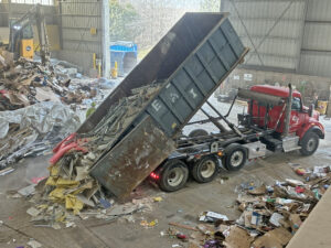 EAI Rolloff dumping recyclables at C&D Recovery
